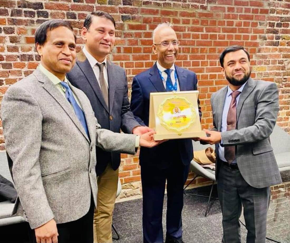Civic reception — presenting a crest to the Mayor of Tower Hamlets
