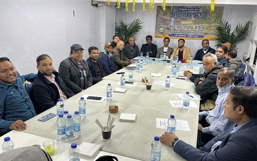 Members gathered around the table at a get-together